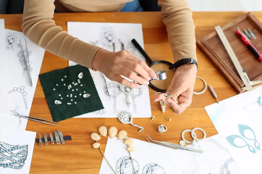 Designer examining jewelry