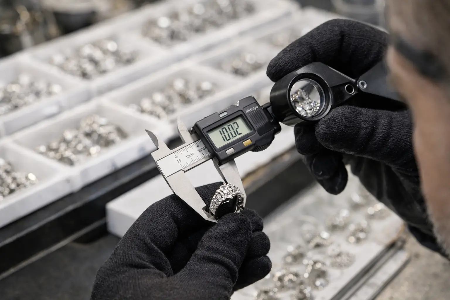 Quality control inspector checking jewelry dimensions and plating thickness