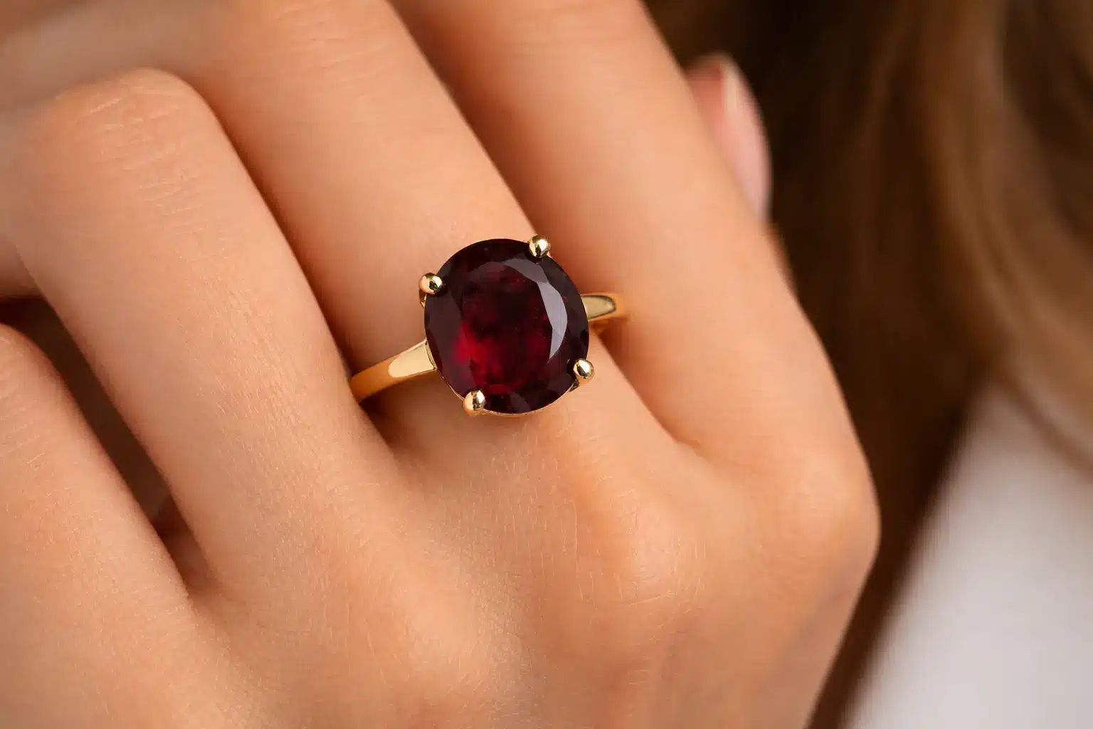 Oxblood garnet ring with claw setting